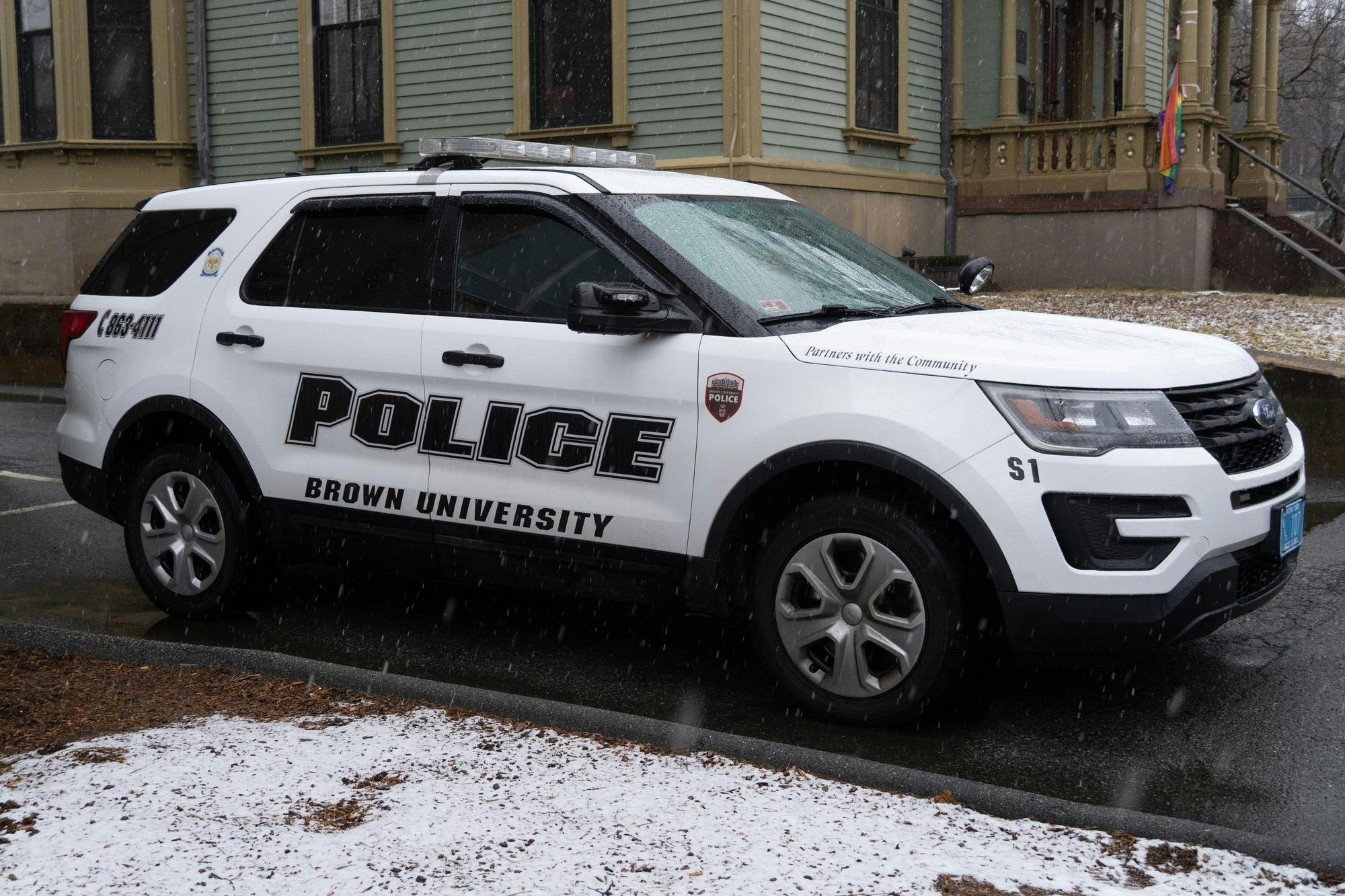 Photo of white Brown University Police SUV.

