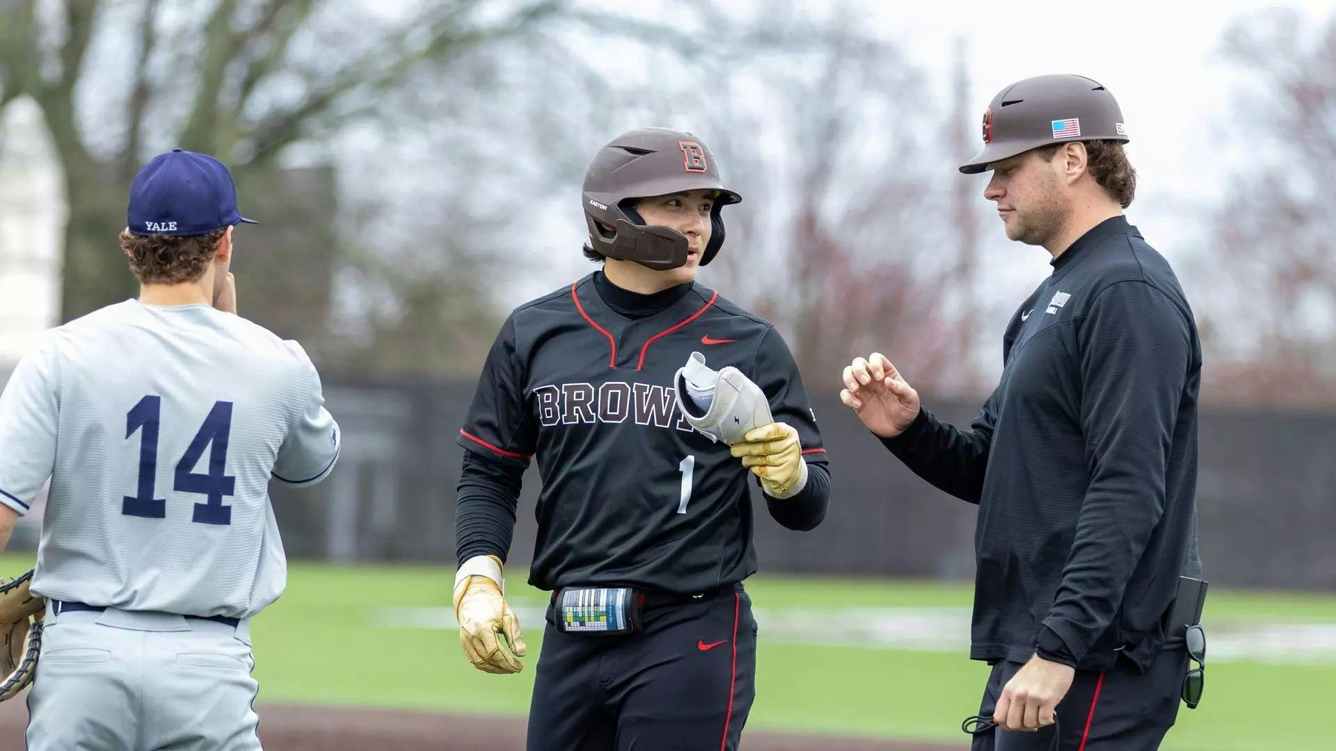 Two baseball players converse.