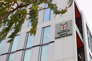 Close-up photo of 225 Dyer St., with its large “Brown University School of Professional Studies” logo in view.