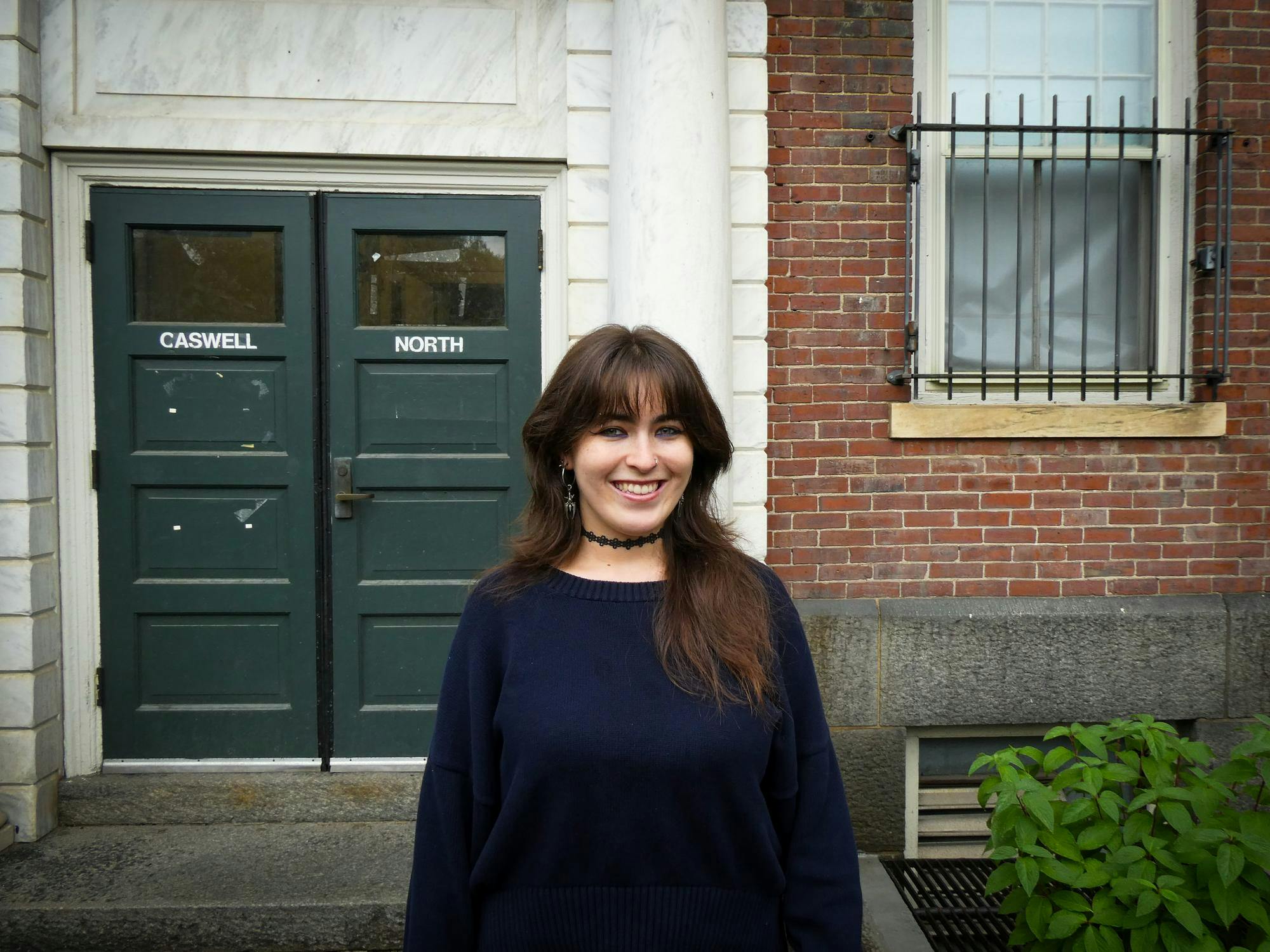 Photo of Delaney O'Dea '28 in front of building.