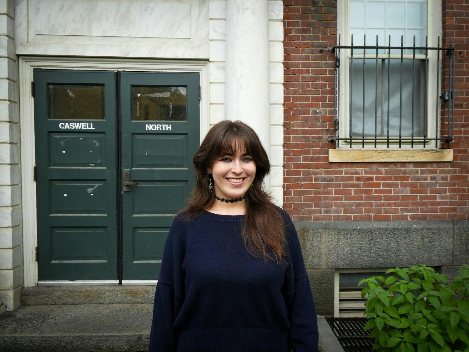 Photo of Delaney O'Dea '28 in front of building.