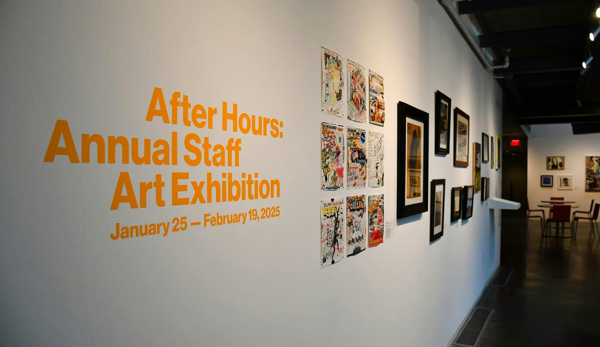 An image of the front of the gallery, with a sign reading "After Hours: Annual Staff Art Exhibition" and a cluster of comic-book pages and paintings by staff visible in the background.
