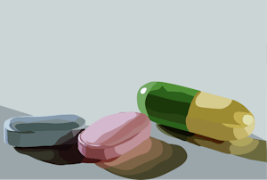 An illustration of three pills sitting on a blue background. The leftmost pill is blue, the middle pill is pink and the rightmost pill is green and yellow.