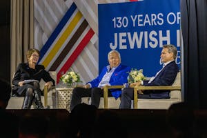 Photo of a panel discussion between Christina Paxson, Brian Moynihan, and Robert Kraft