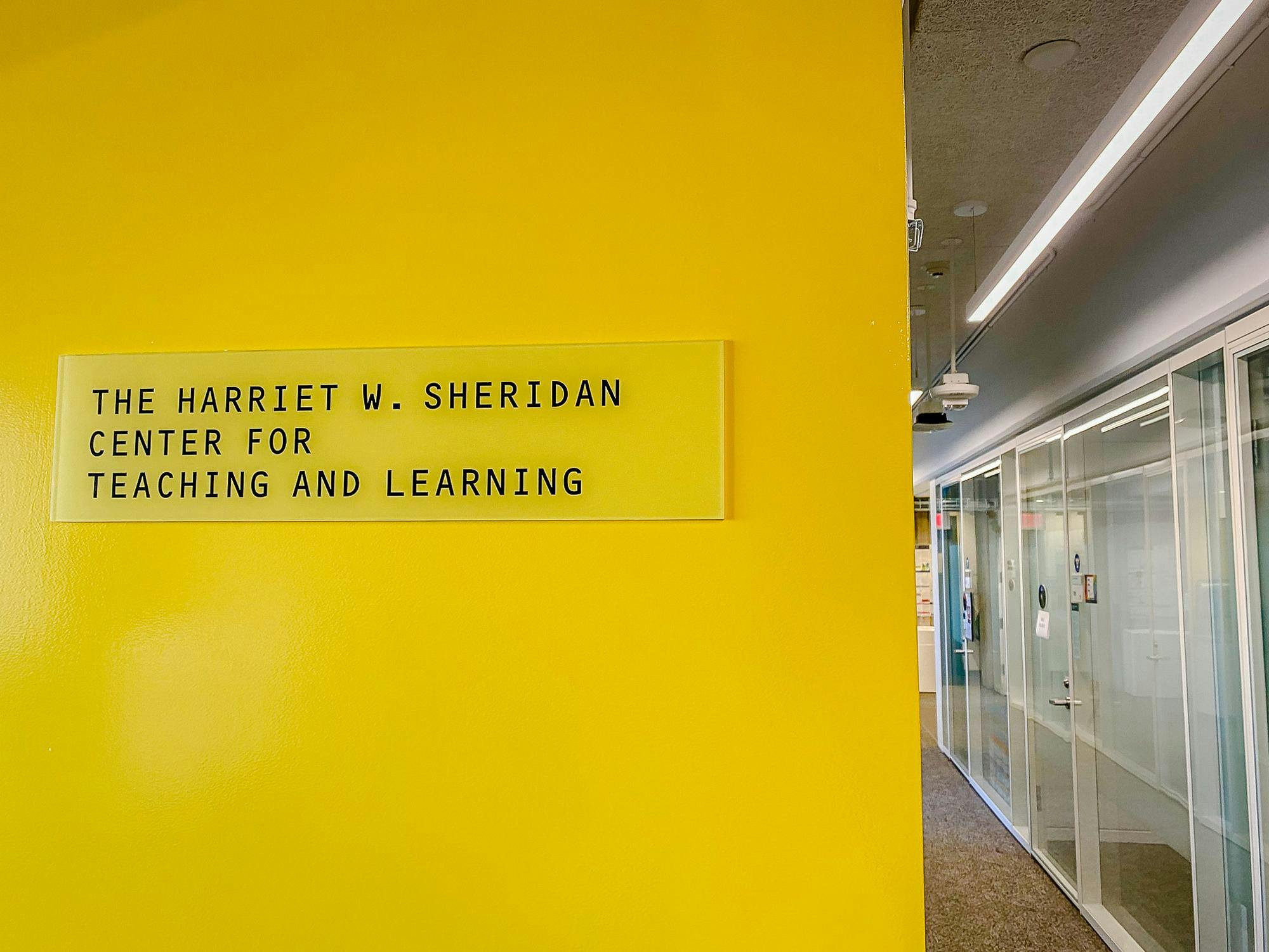 Yellow sign with text "The Harriet W. Sheridan Center for Teaching and Learning"