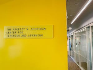Yellow sign with text "The Harriet W. Sheridan Center for Teaching and Learning"