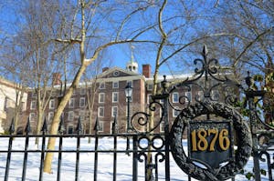 Photo of University Hall from outside the gates around the Brown University campus.


