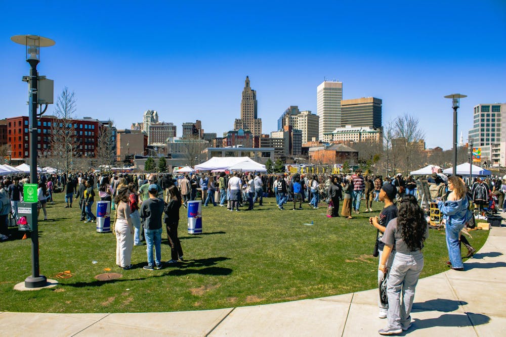 Photo of people at Riverside Park on a sunny day for the thrifting event. 