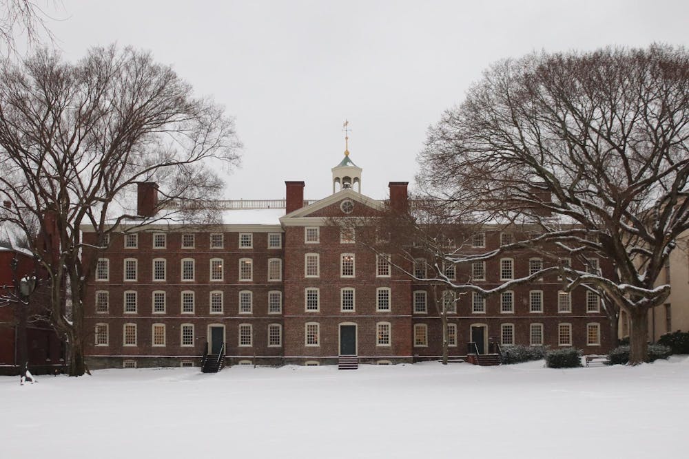 University Hall with a blanket of snow on the Main Green in front of it.