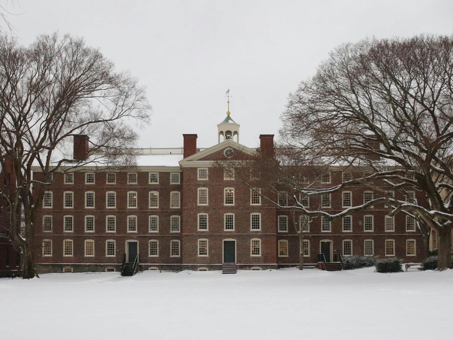 University Hall with a blanket of snow on the Main Green in front of it.