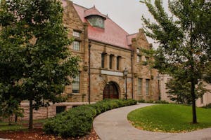 Photo of Friedman Hall, a stone building.

