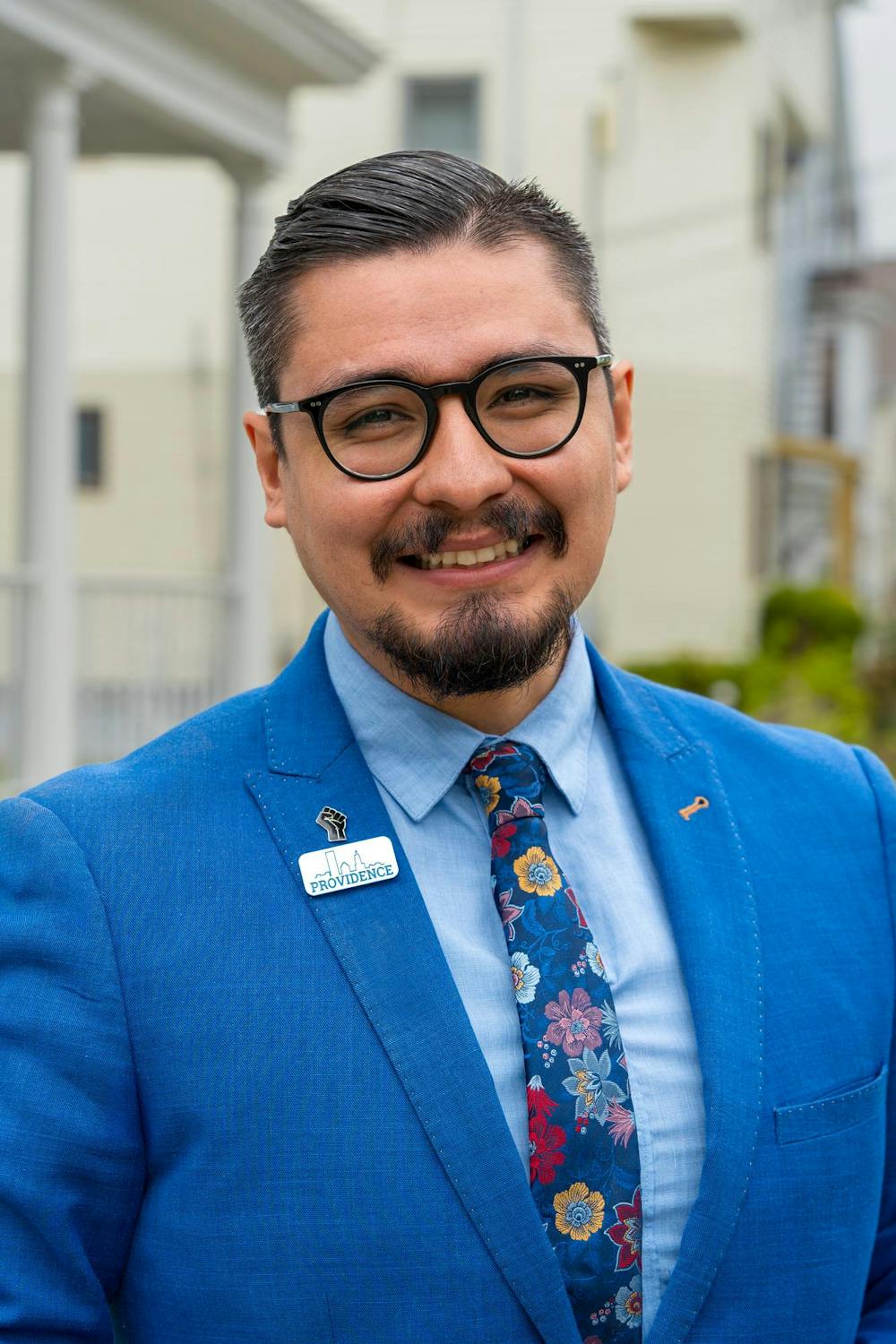 David Morales smiling in a blue suit.