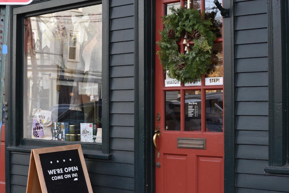 The facade of a small business on Wickenden Street. A wreath hangs on the door.