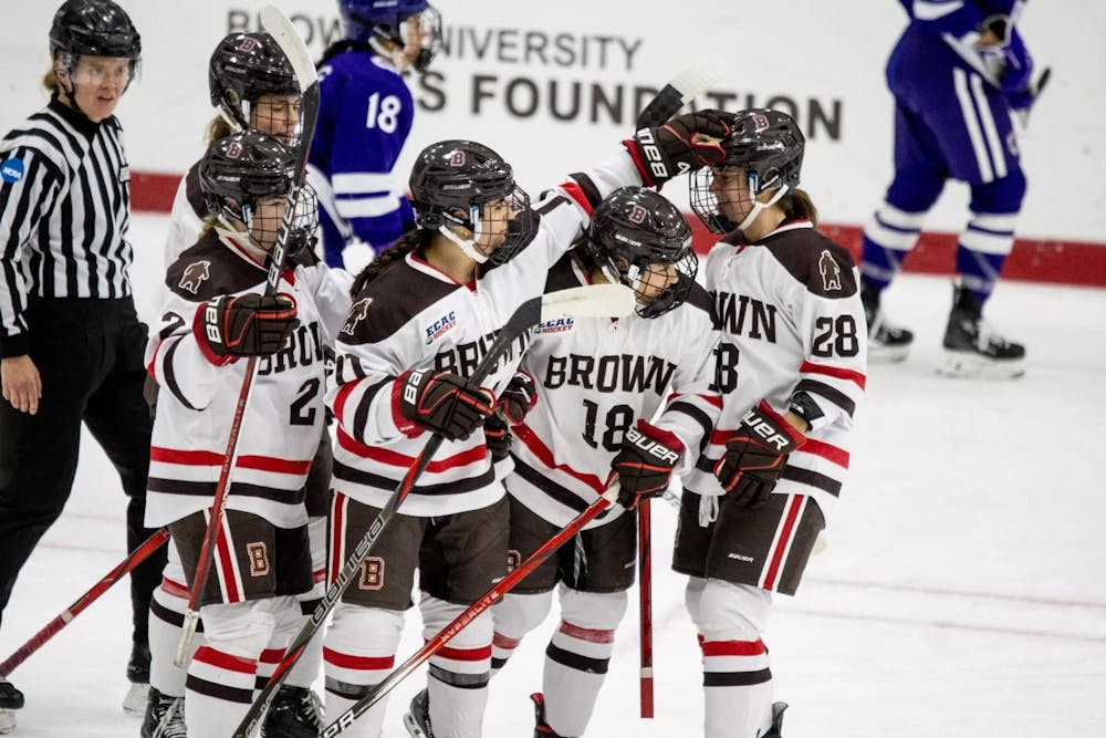 Hockey players cheering each other.