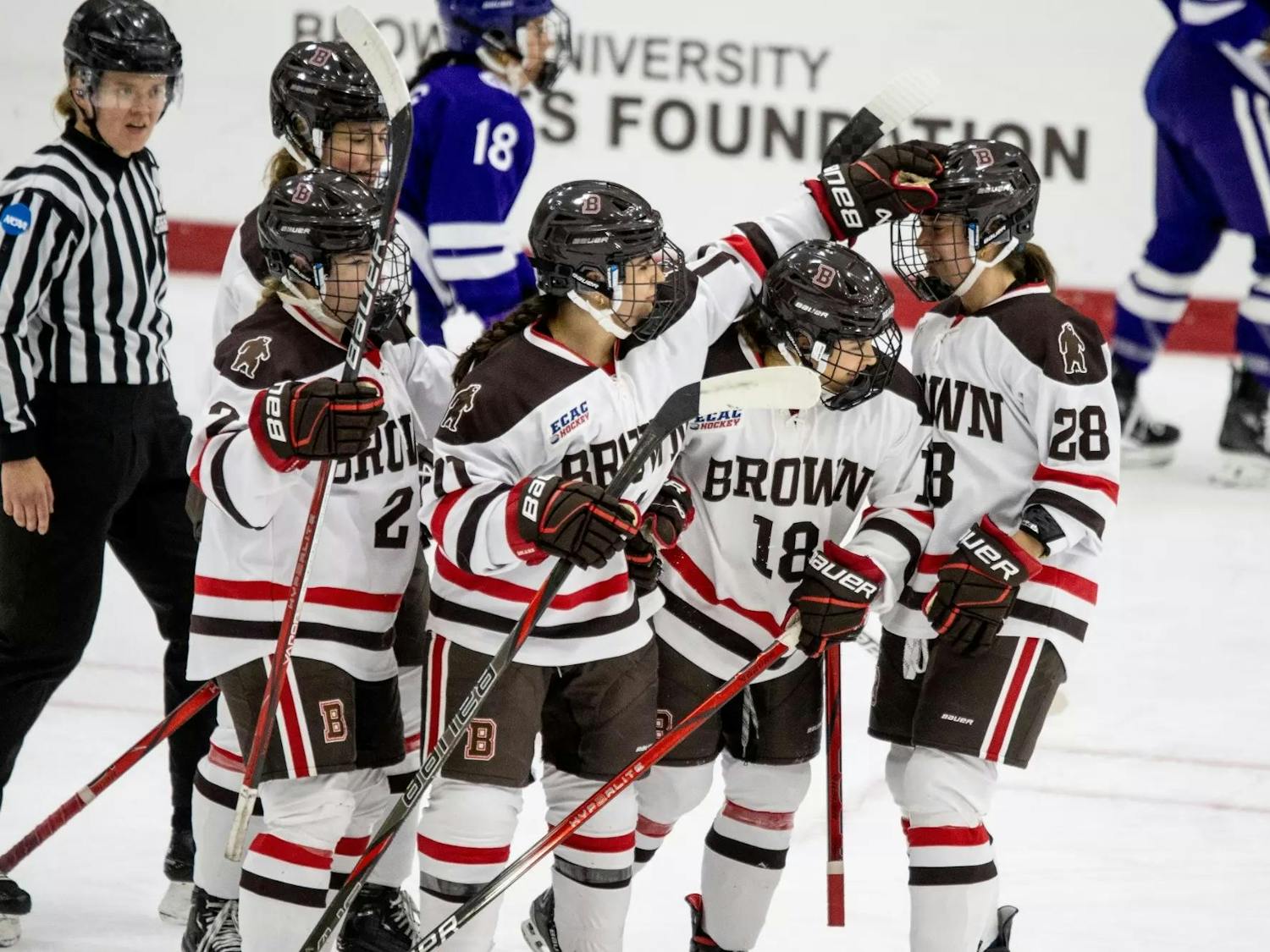 Hockey players cheering each other.