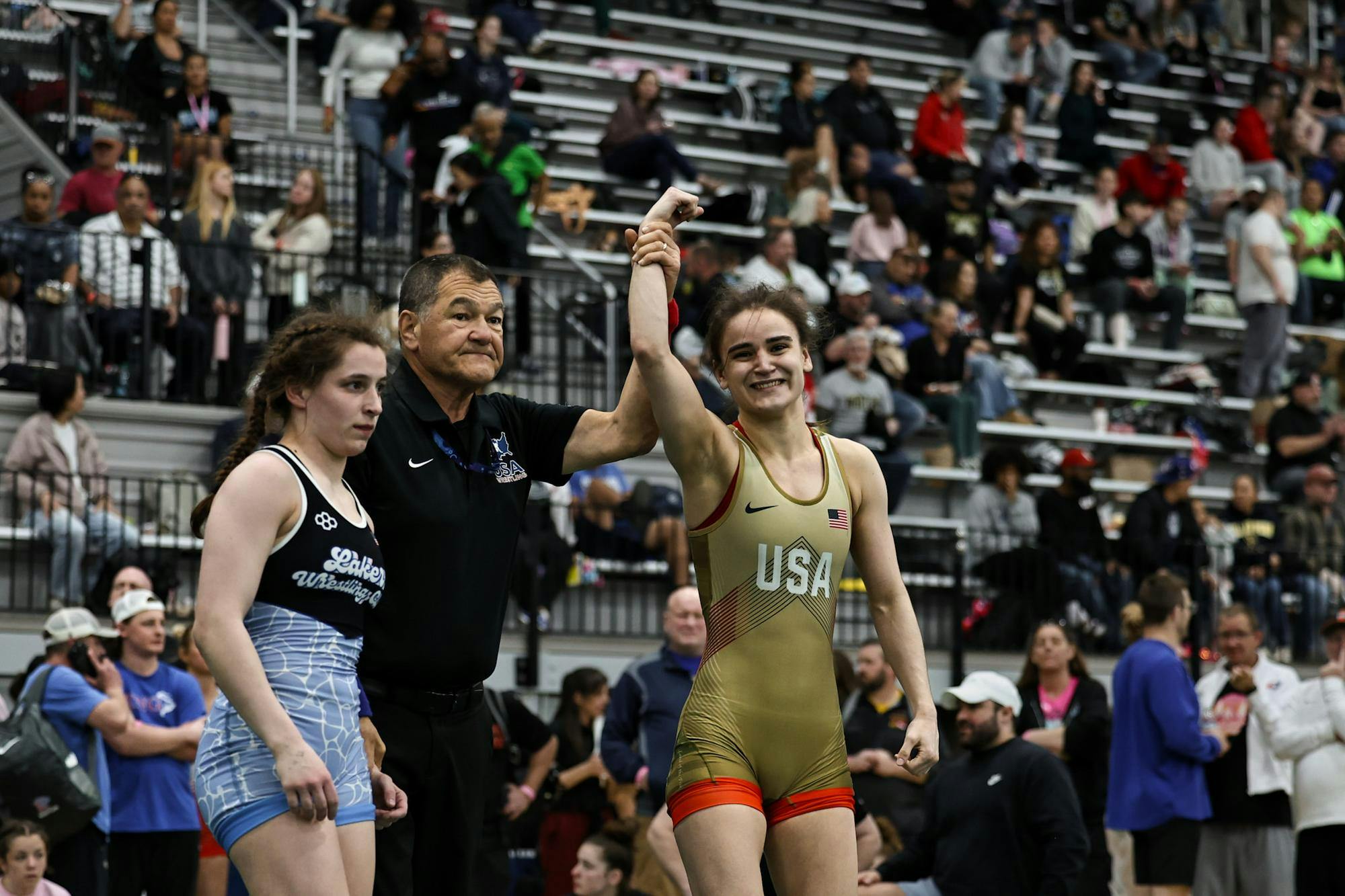 Photo of Calli Gilchrist ’29 after winning against a wrestling opponent. 
