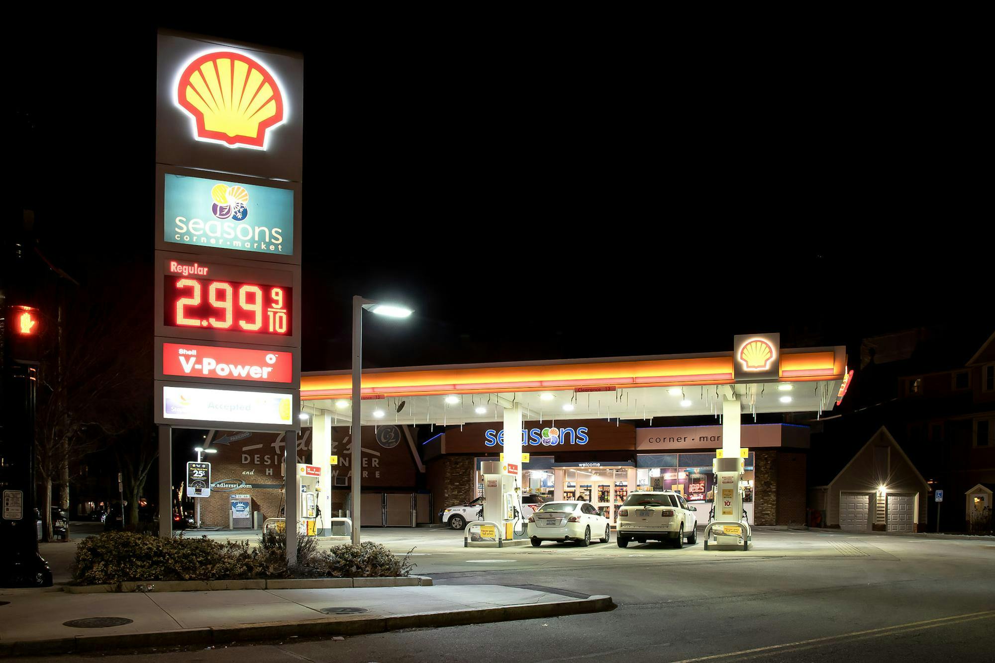 Photo of a Shell gas station at night.