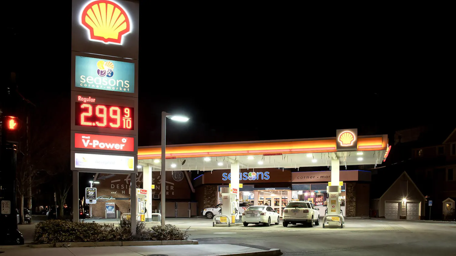Photo of a Shell gas station at night.
