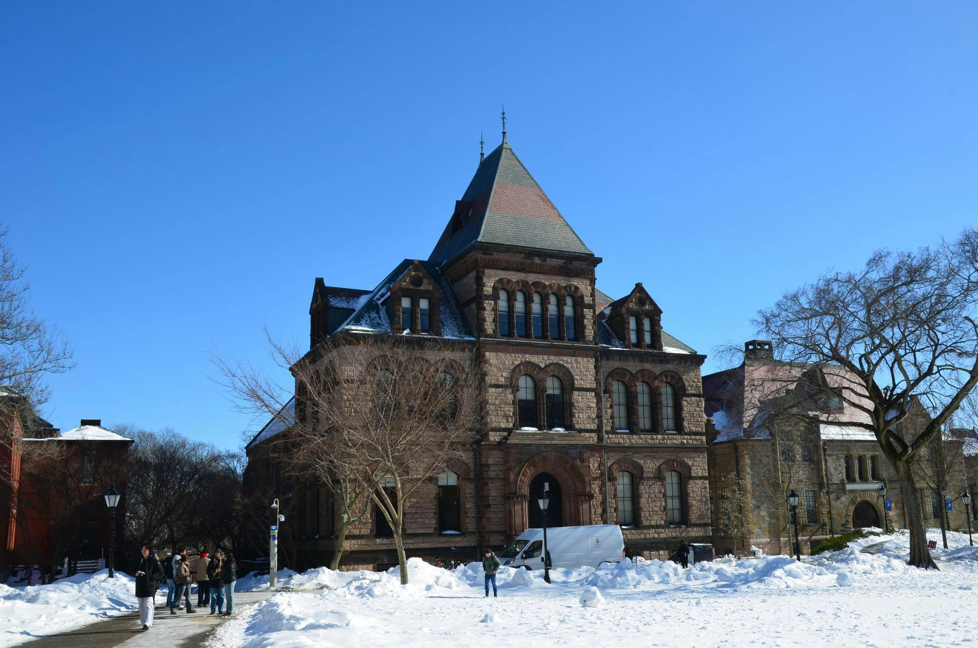 Photo of Sayles Hall with snow surrounding it.