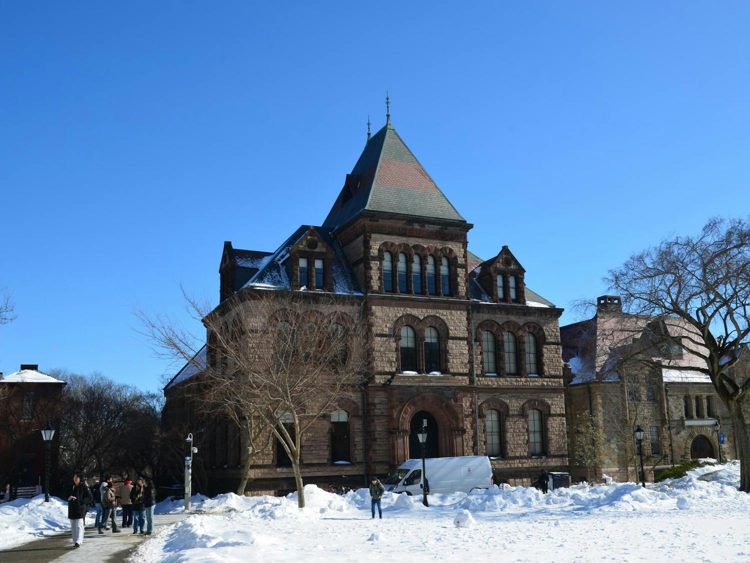 Photo of Sayles Hall with snow surrounding it.