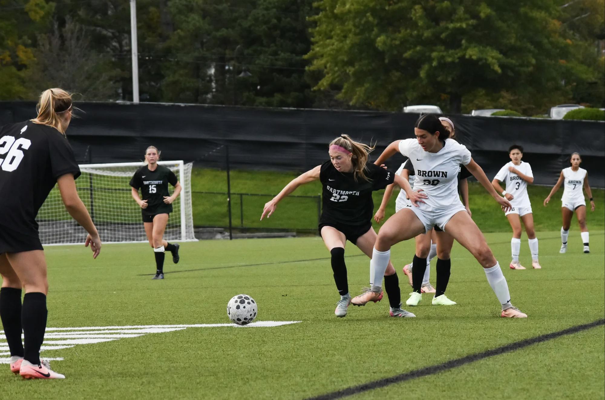 Midfielder Ella Weil ’28 battles with an opposing Dartmouth player for possession of the ball. 
