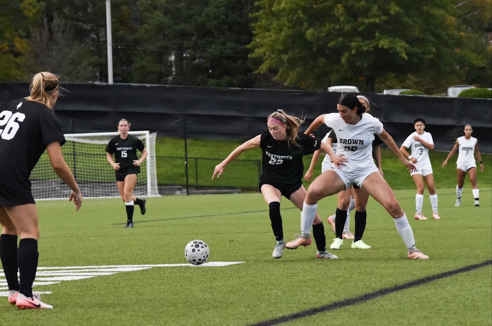 Midfielder Ella Weil ’28 battles with an opposing Dartmouth player for possession of the ball. 