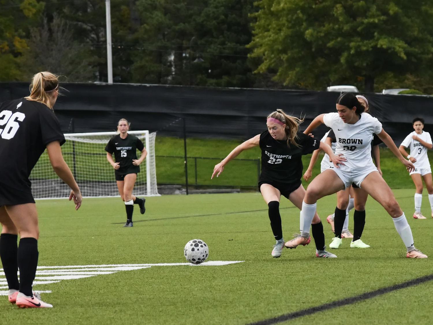 Midfielder Ella Weil ’28 battles with an opposing Dartmouth player for possession of the ball.