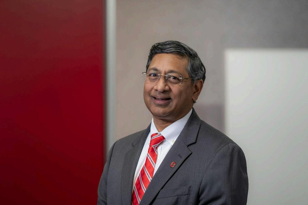 Headshot of Ravi Bellamkonda PhD’95 in a grey suit and red tie.