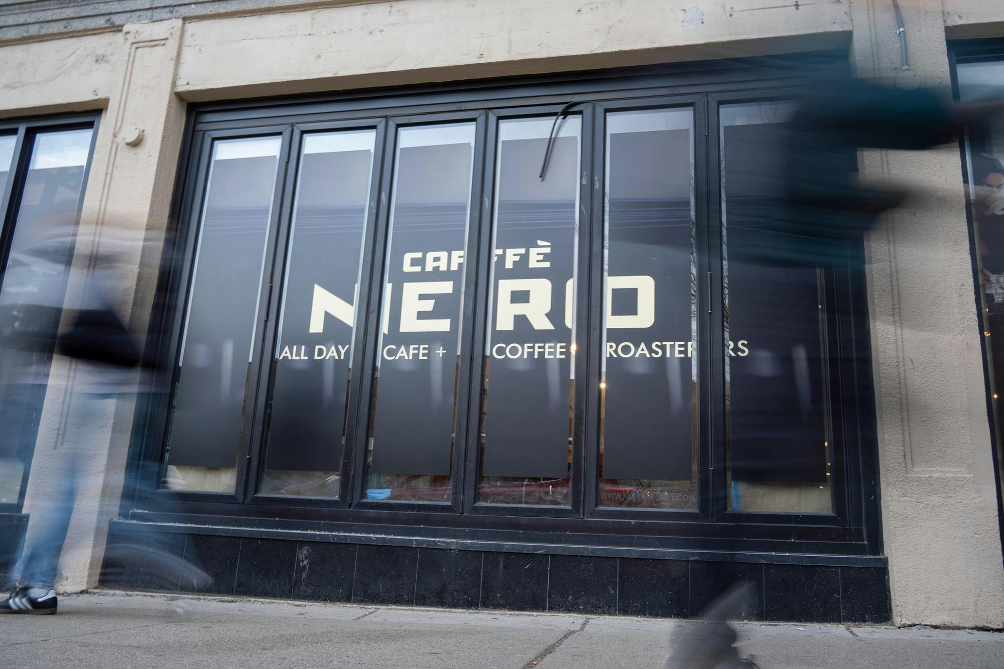 A picture of a store front that says "Caffè Nero."