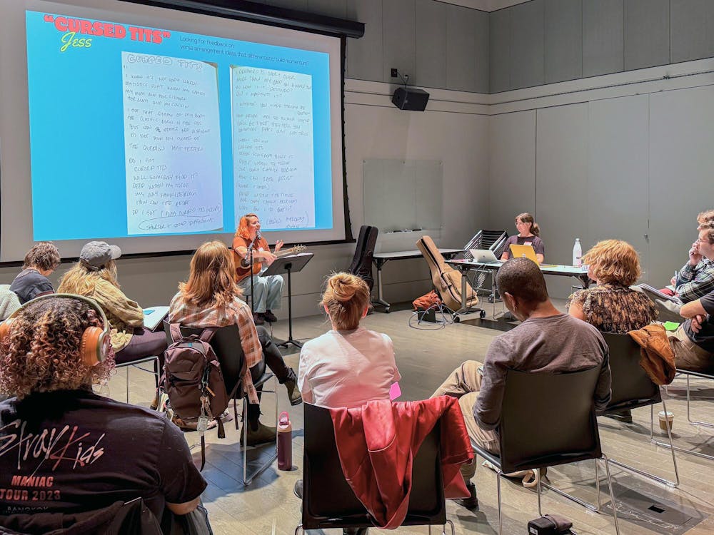 A group of musicians in a circle.