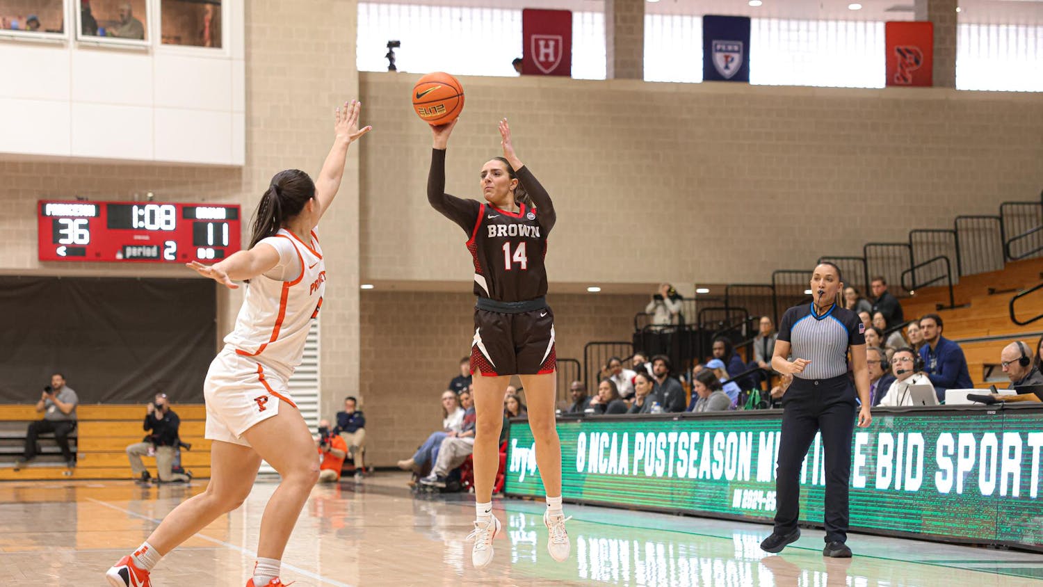 A photo of Mady Calhoun ’26 shooting a three-point shot with a Princeton defender in front of her.