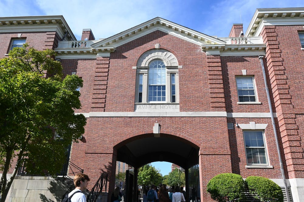 Faunce Arch, a brick building, on a sunny day.