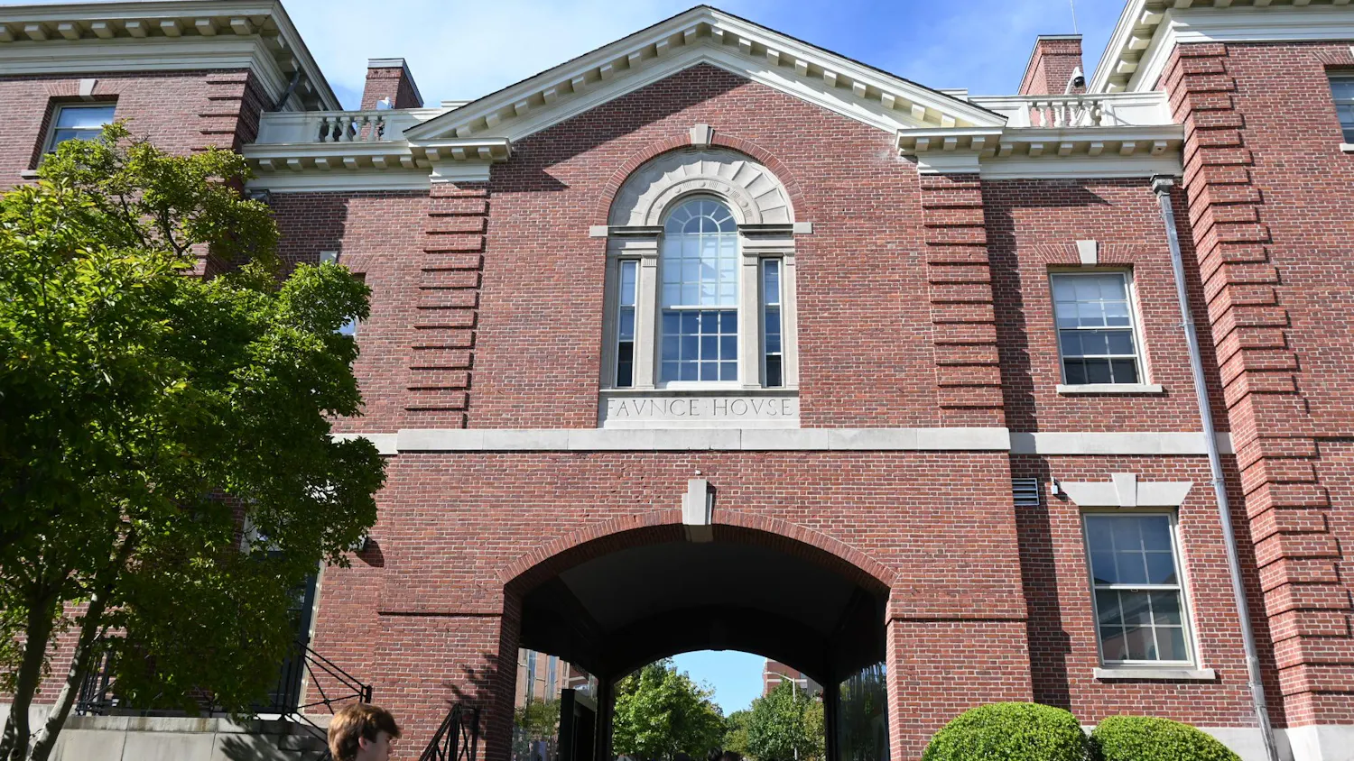 Faunce Arch, a brick building, on a sunny day.