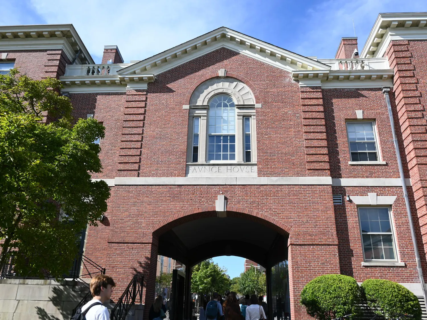 Faunce Arch, a brick building, on a sunny day.