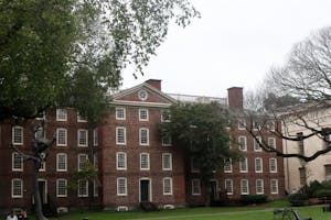Photo of University Hall with trees in front of it.