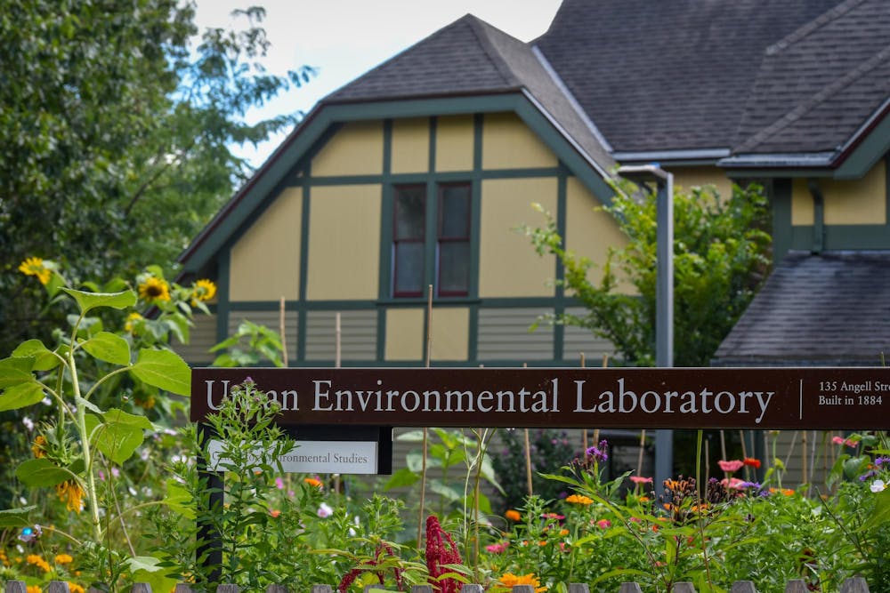 Photo of Brown’s Urban Environmental Laboratory. Garden beds occupy the foreground.