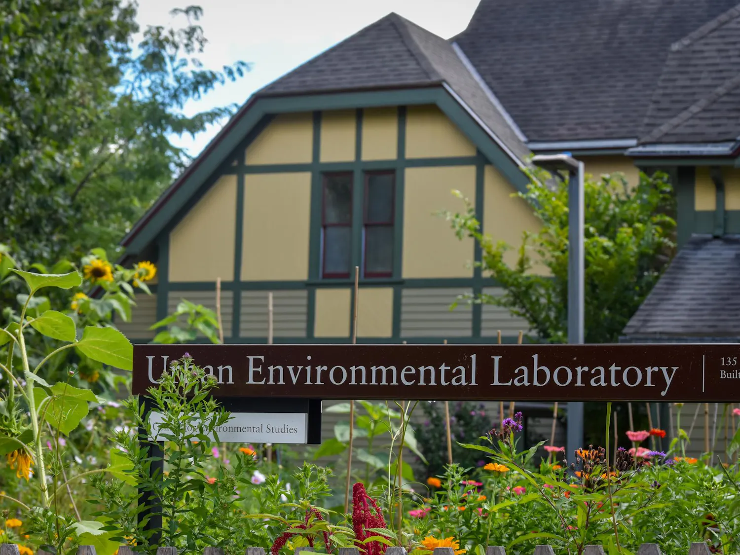 Photo of Brown’s Urban Environmental Laboratory. Garden beds occupy the foreground.