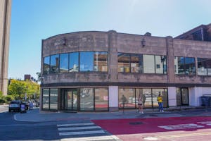 Photo of 218 Thayer Street, formerly the site of Starbucks, with its windows papered over.