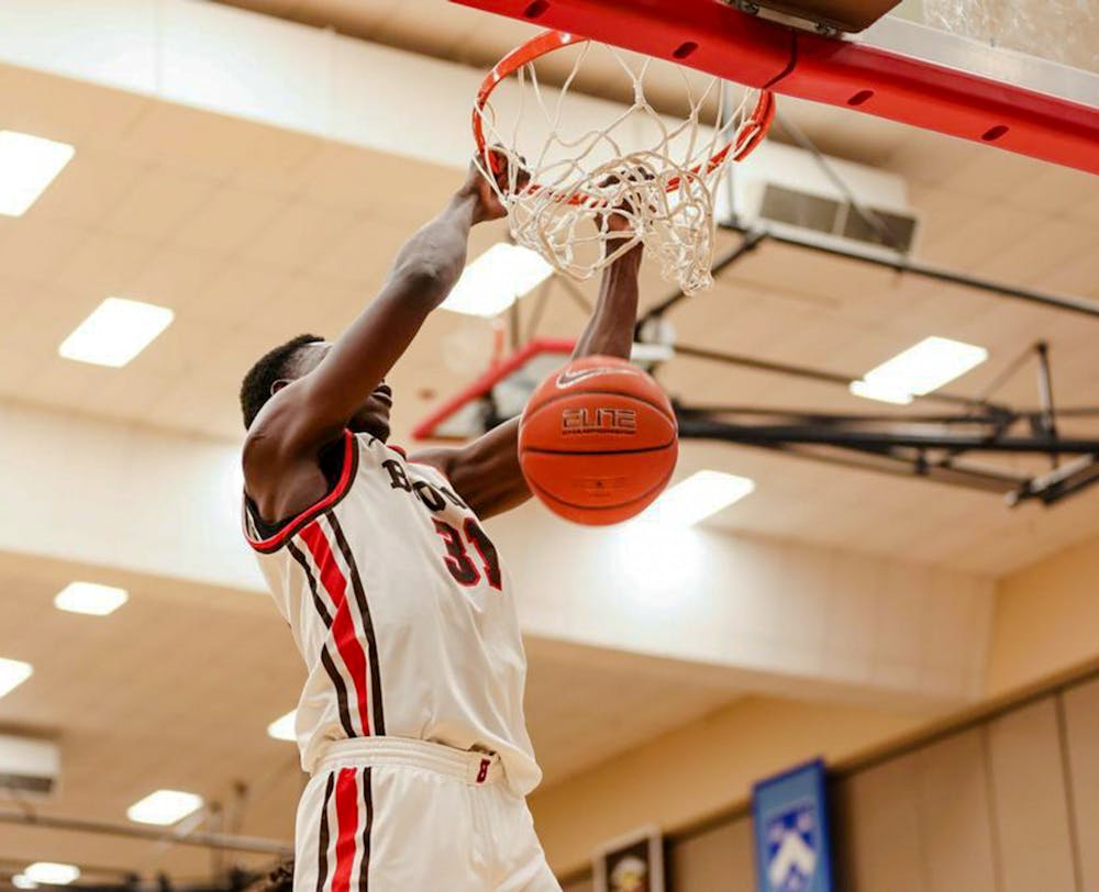 <p>With one minute remaining in the first half, Nana Owusu-Anane ’25 scored a putback off his own miss, while Paxson Wojcik ’23 forced a miss and then scored a reverse layup to take an eight point lead.</p><p>Courtesy of Emma Marion via Brown Athletics﻿</p>