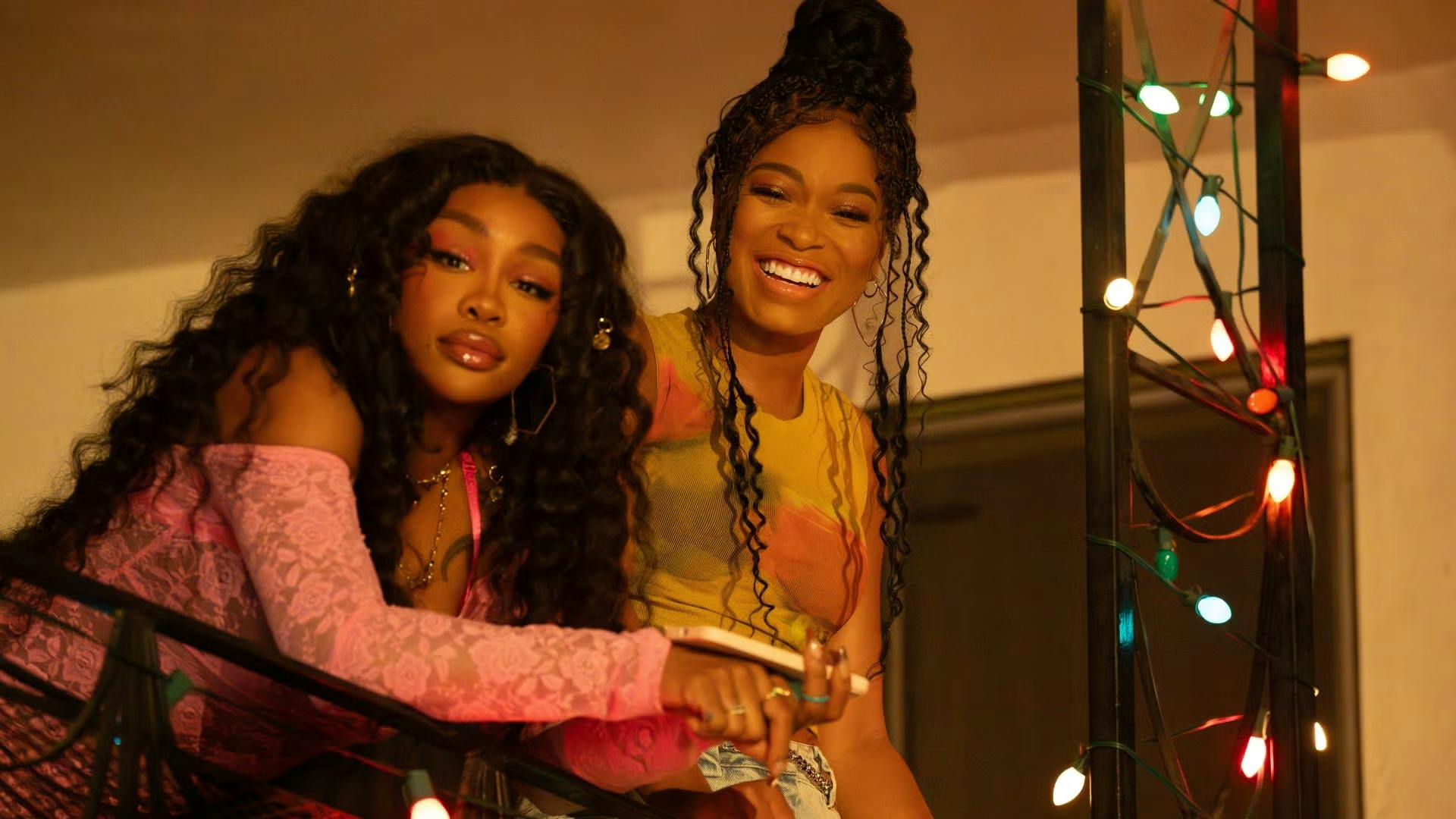 Photo of Keke Palmer and SZA leaning over a railing in "One of Them Days."