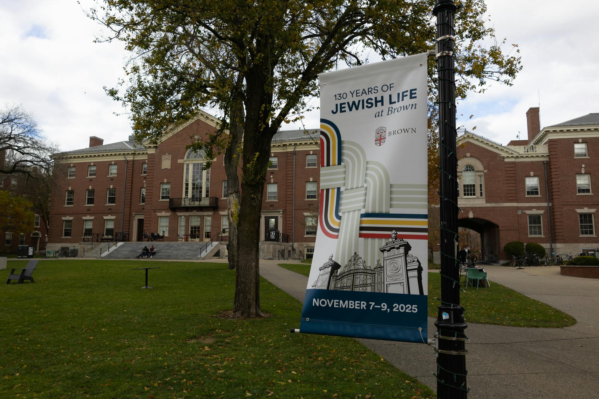 A picture of a "130 Years Of Jewish Life at Brown" banner in front of the Stephen Robert '62 Campus Center.
