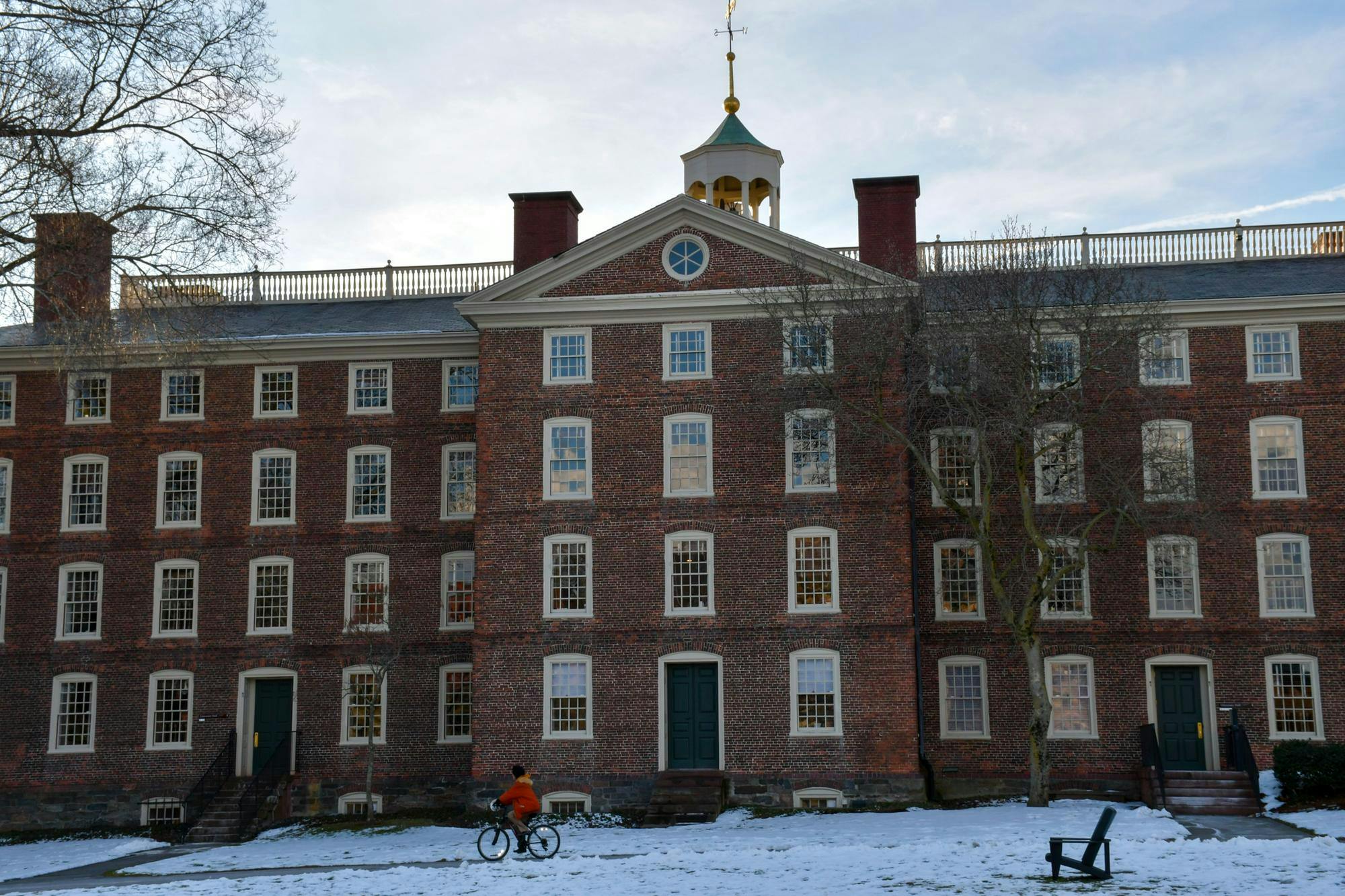 Brown University’s University Hall during the day with snow in front of the building.