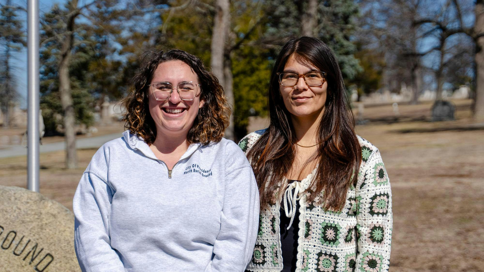 A headshot picture of Annalisa Heppner (left) and Jordi Rivera Prince (right) against a cemetery.