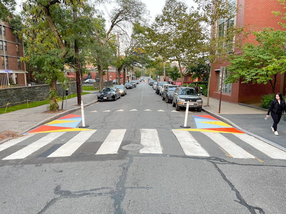 <p>In an effort to encourage compliance with laws preventing cars from parking within 20 feet of crosswalks, the Brown Urban Mobility Project is engaging in “daylighting” — painting the space near crosswalks to discourage cars from parking in the area. Courtesy of Noah Howard.</p>