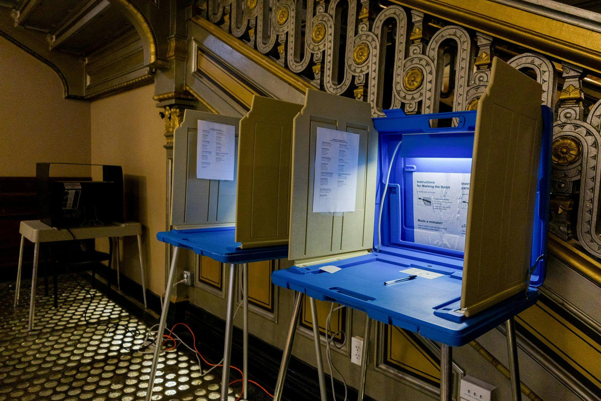 Photo of Rhode Island polls next to a staircase at City Hall.

