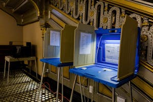 Photo of Rhode Island polls next to a staircase at City Hall.

