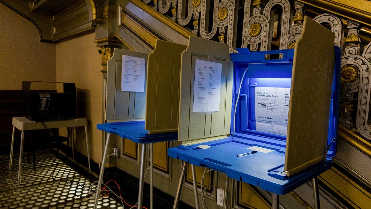 Photo of Rhode Island polls next to a staircase at City Hall.