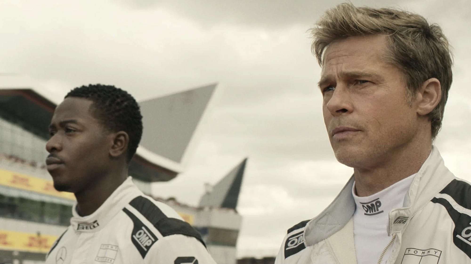 Still from “F1” showing Sonny Hayes (right), played by Brad Pitt, and Joshua Pearce (left), played by Damson Idris.
