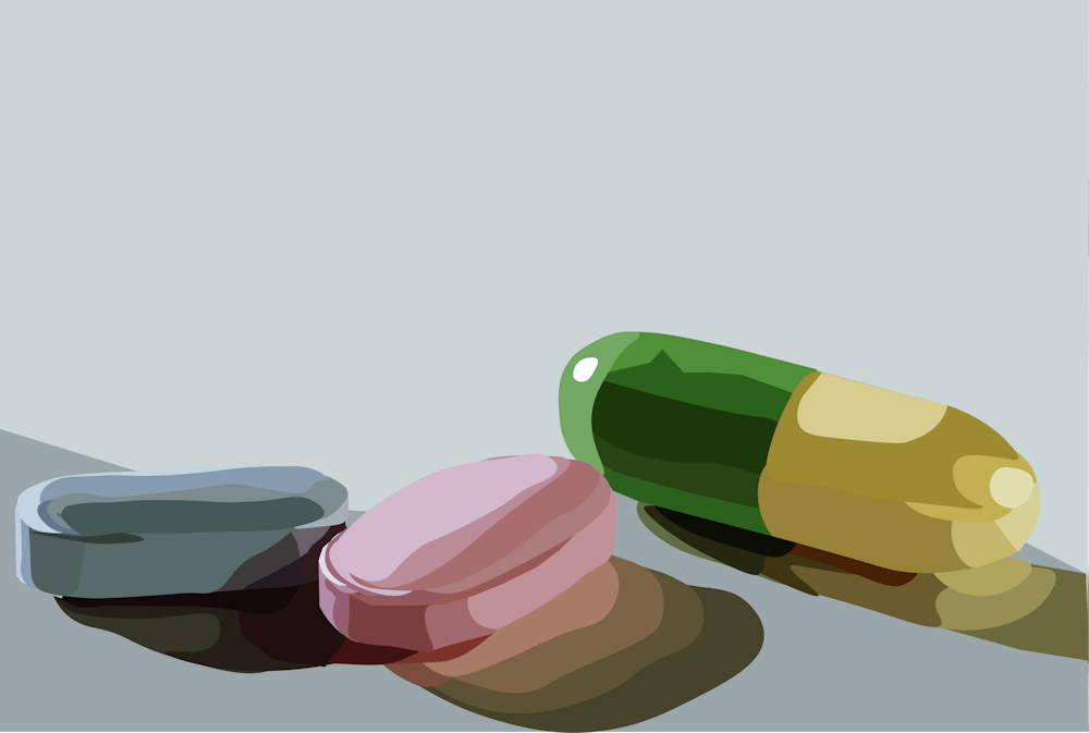 An illustration of three colorful pills.