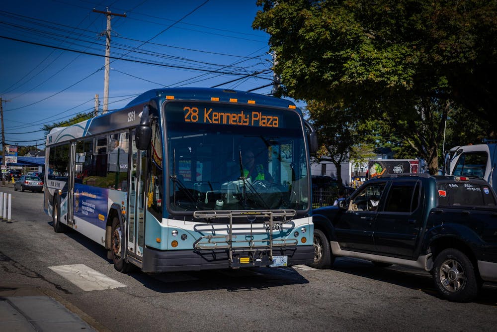 Photo of a bus driving down the street.